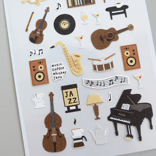 Sheet of music-themed stickers featuring instruments and symbols on a gray background